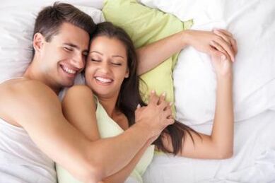 Happy man and girl in bed